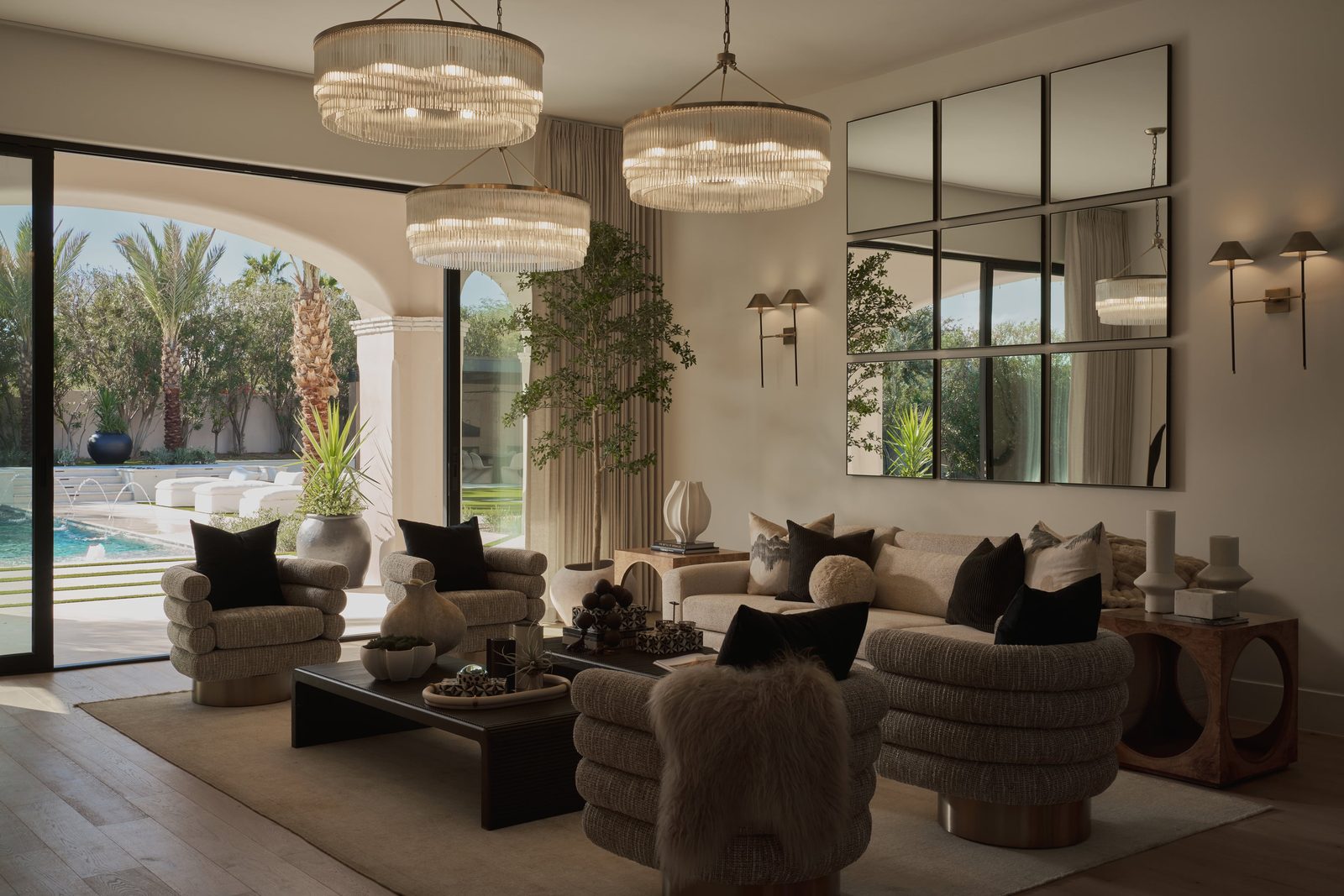 Tomahawk Trail — great room with drum chandeliers and pool view